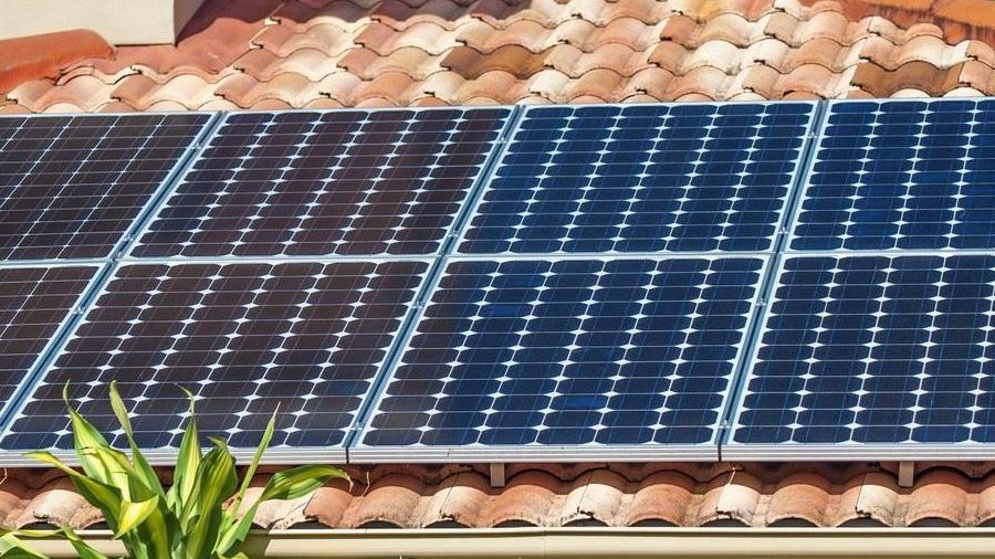 Installed Solar panels on a spanish tiled roof.